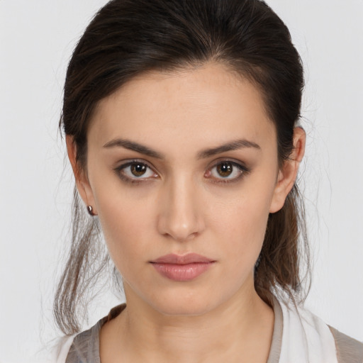 Neutral white young-adult female with medium  brown hair and brown eyes