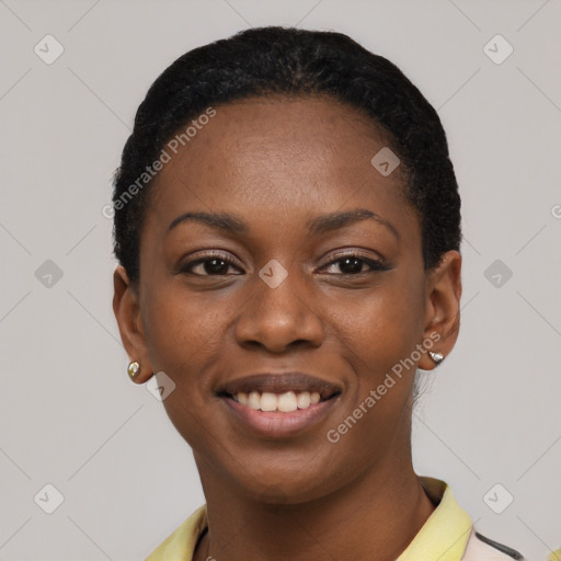 Joyful black young-adult female with short  black hair and brown eyes