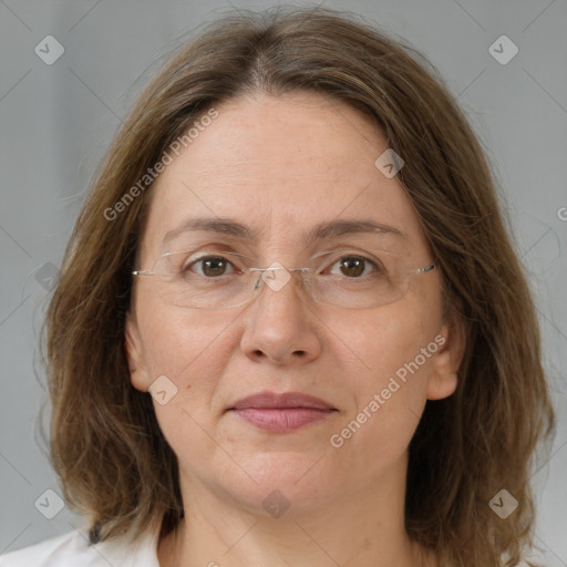 Joyful white adult female with medium  brown hair and grey eyes