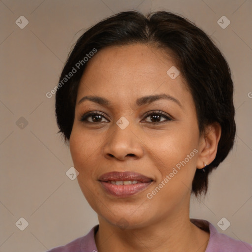 Joyful latino adult female with medium  brown hair and brown eyes