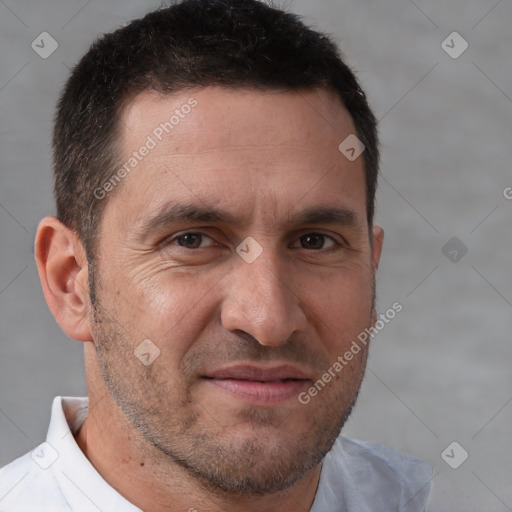 Joyful white adult male with short  brown hair and brown eyes