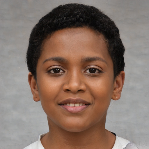 Joyful black child female with short  black hair and brown eyes