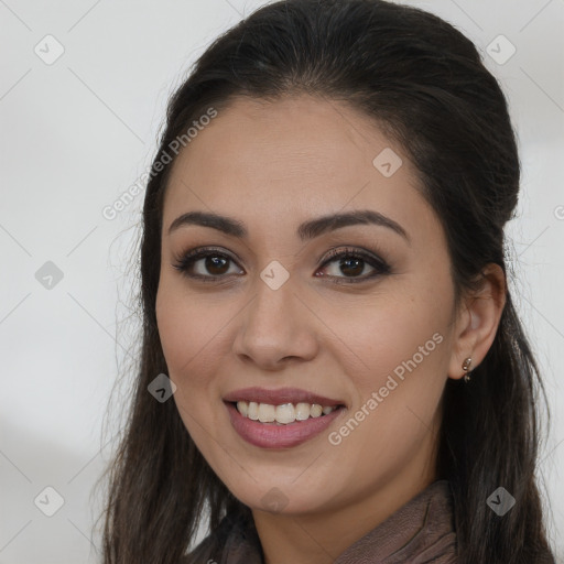 Joyful white young-adult female with long  brown hair and brown eyes