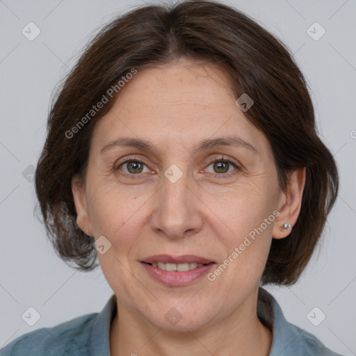 Joyful white adult female with medium  brown hair and brown eyes