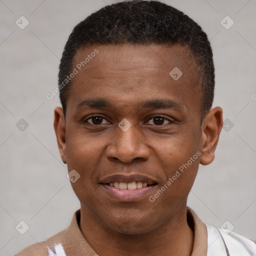 Joyful latino young-adult male with short  brown hair and brown eyes