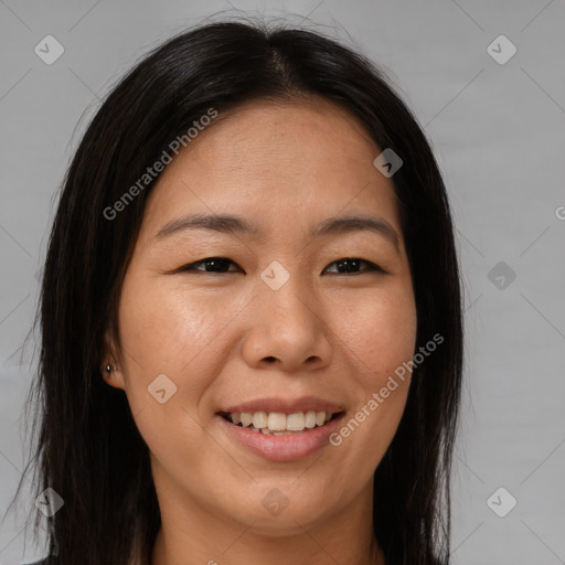 Joyful asian young-adult female with long  brown hair and brown eyes