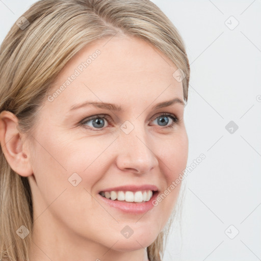 Joyful white young-adult female with long  brown hair and blue eyes