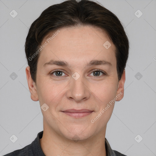 Joyful white adult female with short  brown hair and brown eyes