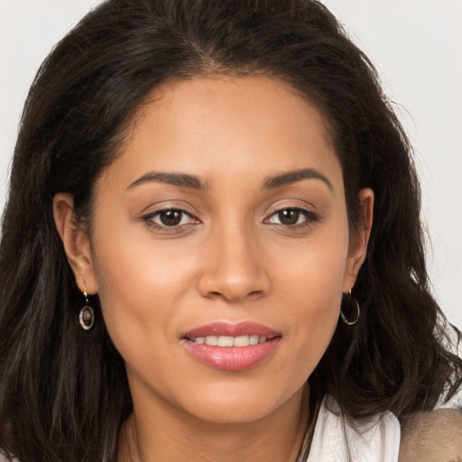 Joyful white young-adult female with long  brown hair and brown eyes