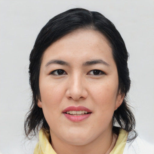 Joyful asian young-adult female with medium  brown hair and brown eyes
