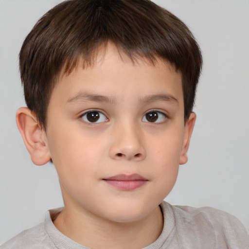 Joyful white child male with short  brown hair and brown eyes