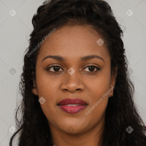 Joyful black young-adult female with long  brown hair and brown eyes