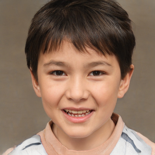 Joyful white child male with short  brown hair and brown eyes