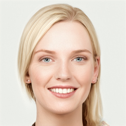 Joyful white young-adult female with long  brown hair and blue eyes