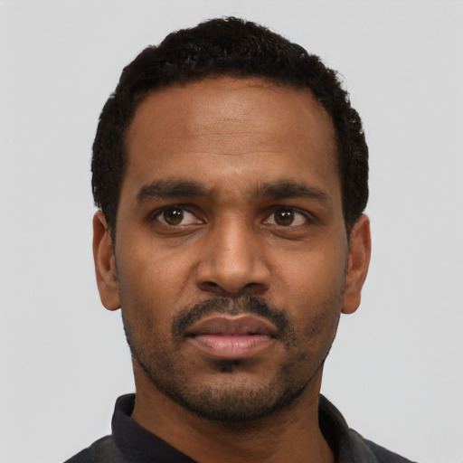 Neutral black young-adult male with short  black hair and brown eyes