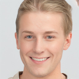 Joyful white young-adult male with short  brown hair and blue eyes