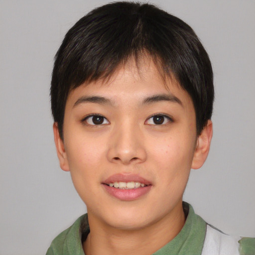 Joyful asian young-adult female with short  brown hair and brown eyes
