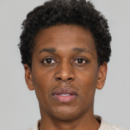 Neutral black young-adult male with short  brown hair and brown eyes