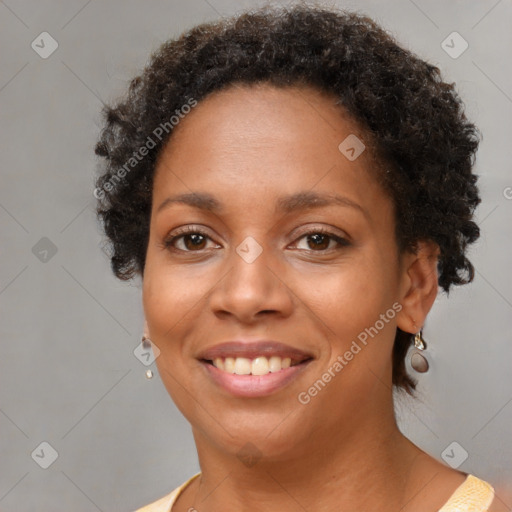 Joyful black young-adult female with short  brown hair and brown eyes