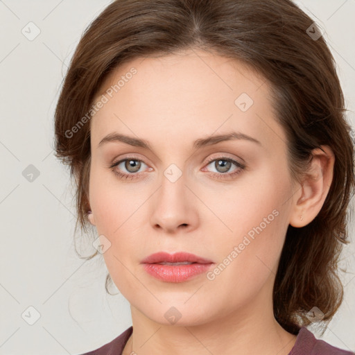 Joyful white young-adult female with medium  brown hair and green eyes