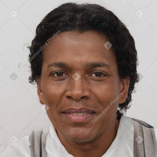 Joyful black adult male with short  brown hair and brown eyes
