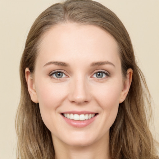 Joyful white young-adult female with long  brown hair and grey eyes