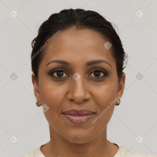 Joyful black adult female with short  brown hair and brown eyes