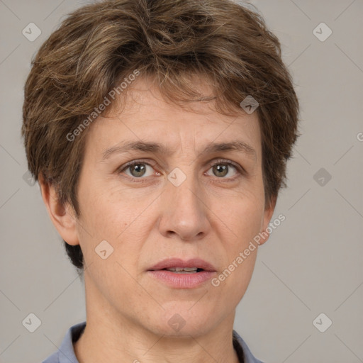 Joyful white adult female with short  brown hair and grey eyes