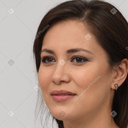 Joyful white young-adult female with long  brown hair and brown eyes