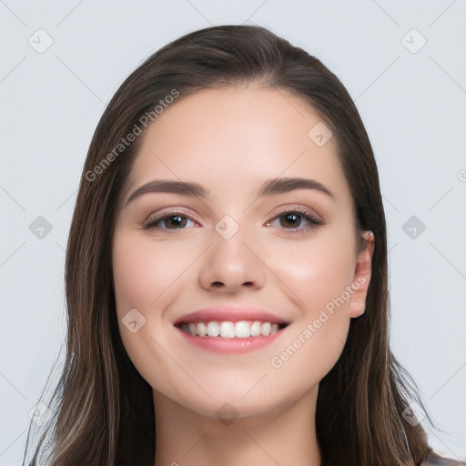 Joyful white young-adult female with long  black hair and brown eyes