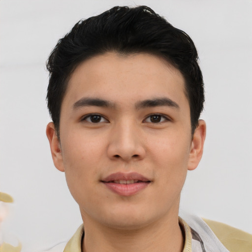 Joyful asian young-adult male with short  black hair and brown eyes