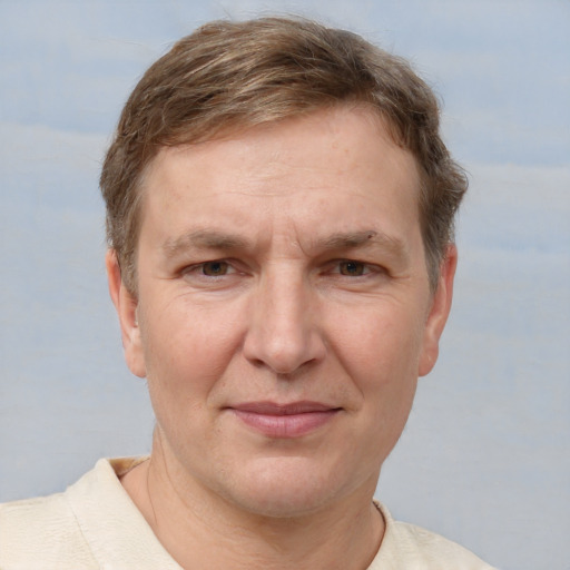 Joyful white adult male with short  brown hair and grey eyes