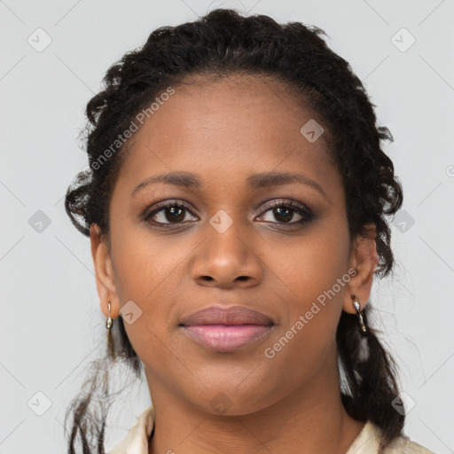 Joyful black young-adult female with medium  brown hair and brown eyes