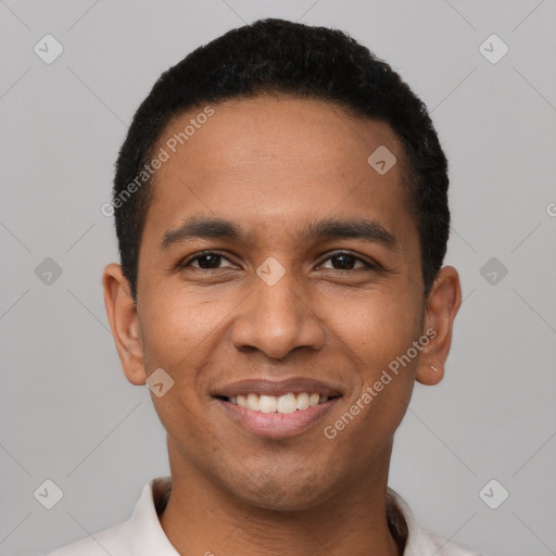 Joyful latino young-adult male with short  black hair and brown eyes