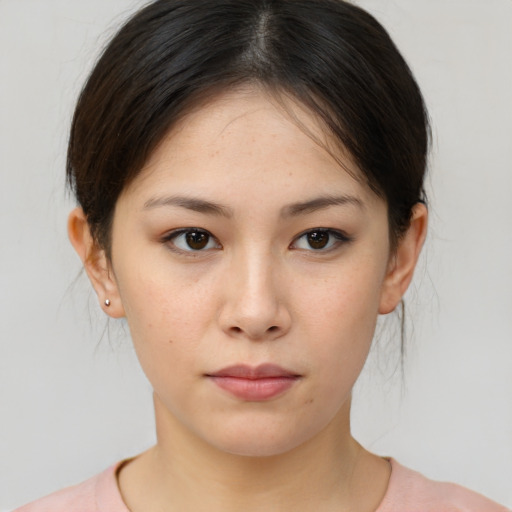 Neutral white young-adult female with medium  brown hair and brown eyes