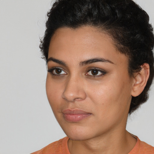 Neutral latino young-adult female with short  brown hair and brown eyes