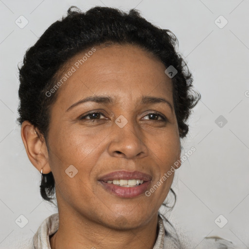 Joyful black adult female with short  brown hair and brown eyes