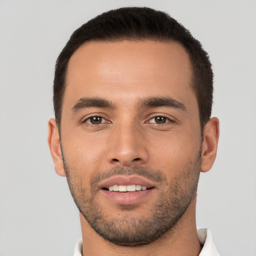 Joyful white young-adult male with short  brown hair and brown eyes