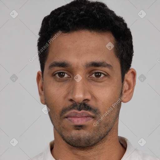 Neutral latino young-adult male with short  black hair and brown eyes