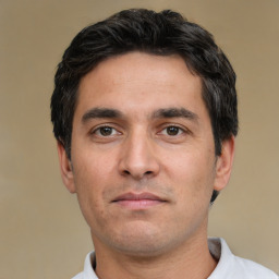 Neutral white young-adult male with short  black hair and brown eyes