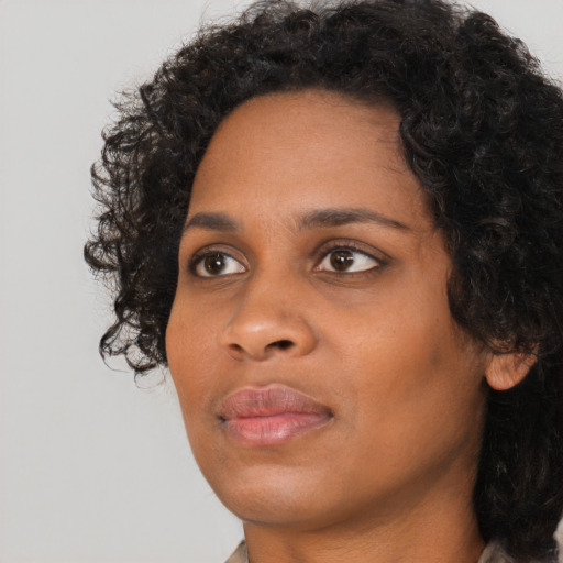 Neutral black young-adult female with short  black hair and brown eyes