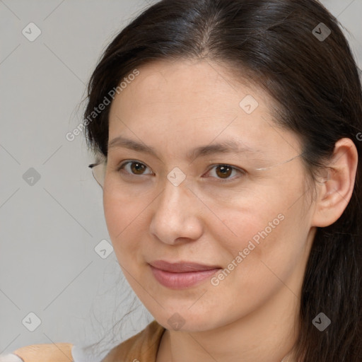 Joyful white adult female with long  brown hair and brown eyes