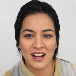 Joyful asian young-adult female with medium  black hair and brown eyes