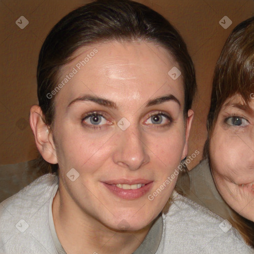 Joyful white adult female with medium  brown hair and blue eyes