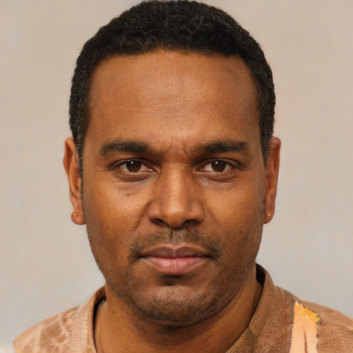 Neutral latino adult male with short  black hair and brown eyes