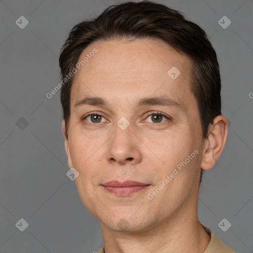 Joyful white adult male with short  brown hair and brown eyes