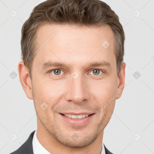 Joyful white young-adult male with short  brown hair and grey eyes