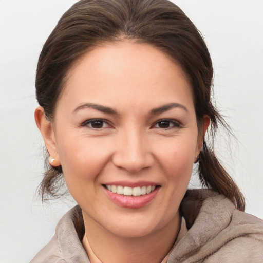 Joyful white young-adult female with medium  brown hair and brown eyes