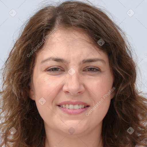 Joyful white adult female with long  brown hair and brown eyes