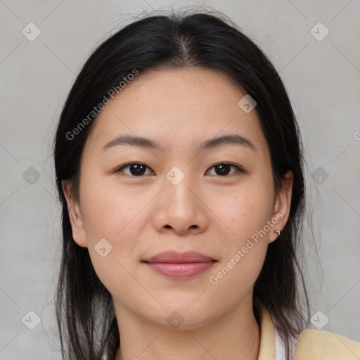 Joyful asian young-adult female with medium  brown hair and brown eyes